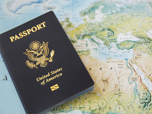passport resting on world map